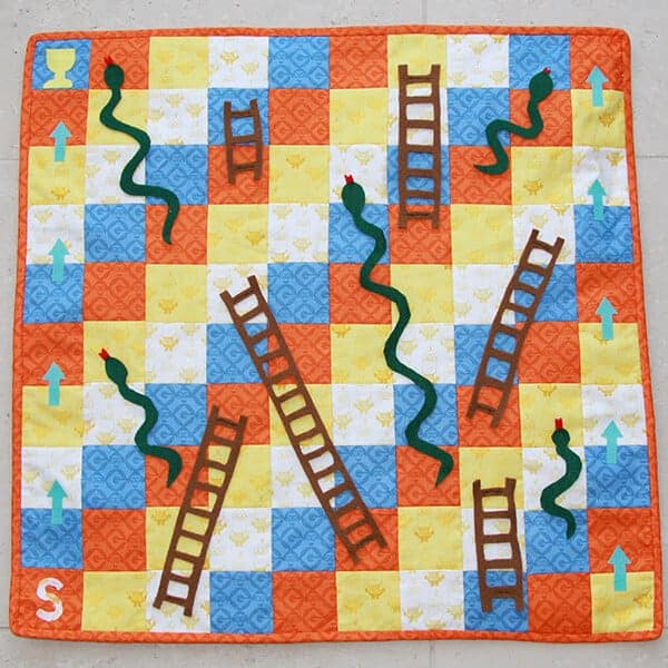 How to sew a quilted Snakes and Ladders playmat - great handmade gift idea for kids (boys and girls - woo hoo). I might have to sew a few for Christmas and birthdays! Easy to follow sewing tutorial.