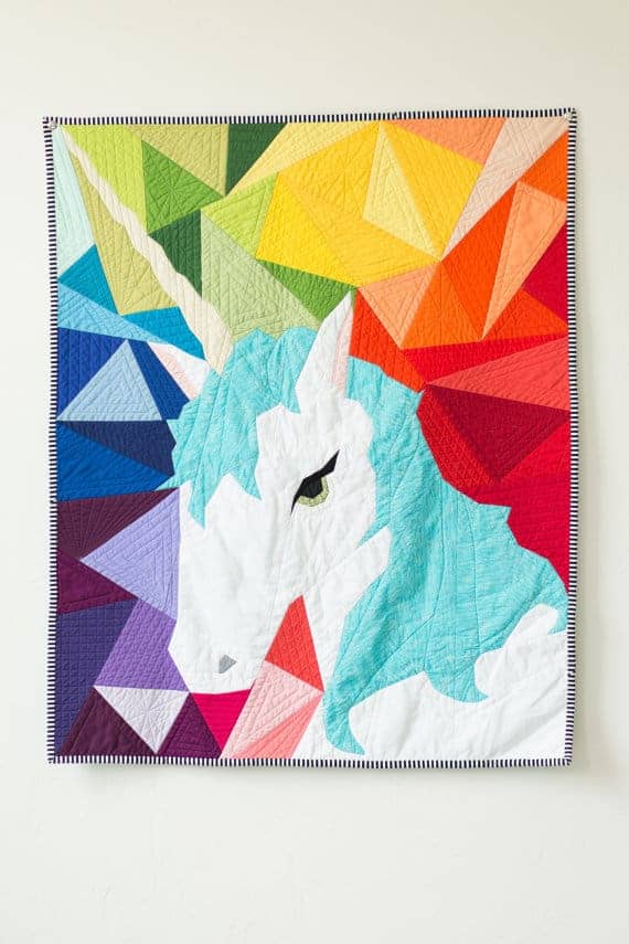 Maybe the Unicorn Paper Piecing Quilt Pattern with geometric rainbow background.