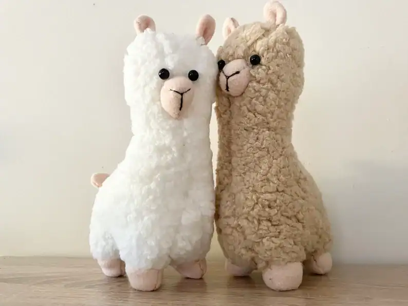 Cute plush llama toys in white and tan, soft and cuddly for kids and collectors.