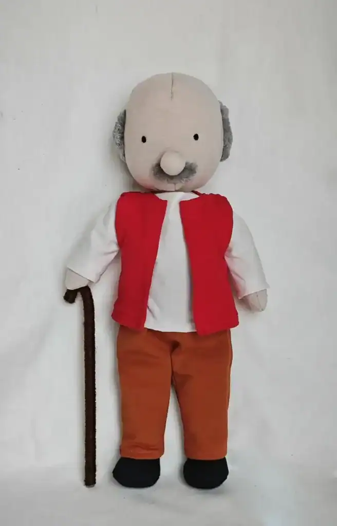 Handmade plush toy of a grandfather with a cane, wearing casual clothes, from Threadistry.