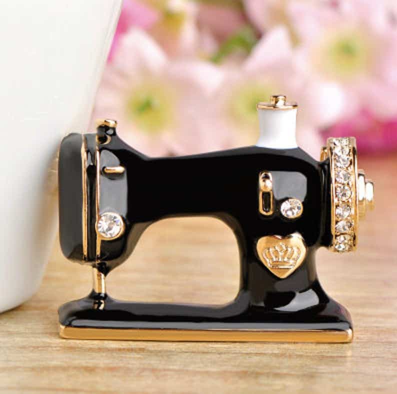 Black enamel sewing machine brooch with tiny crystals