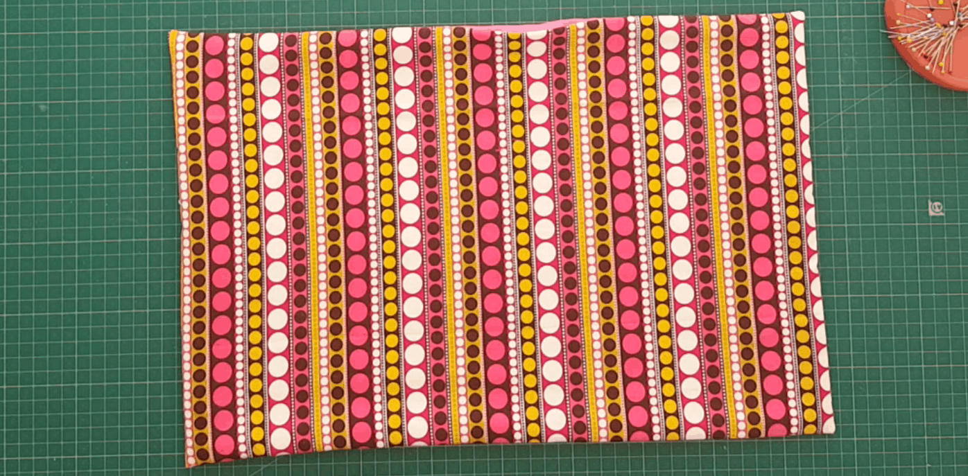 Brightly coloured fabric sewn into a placemat