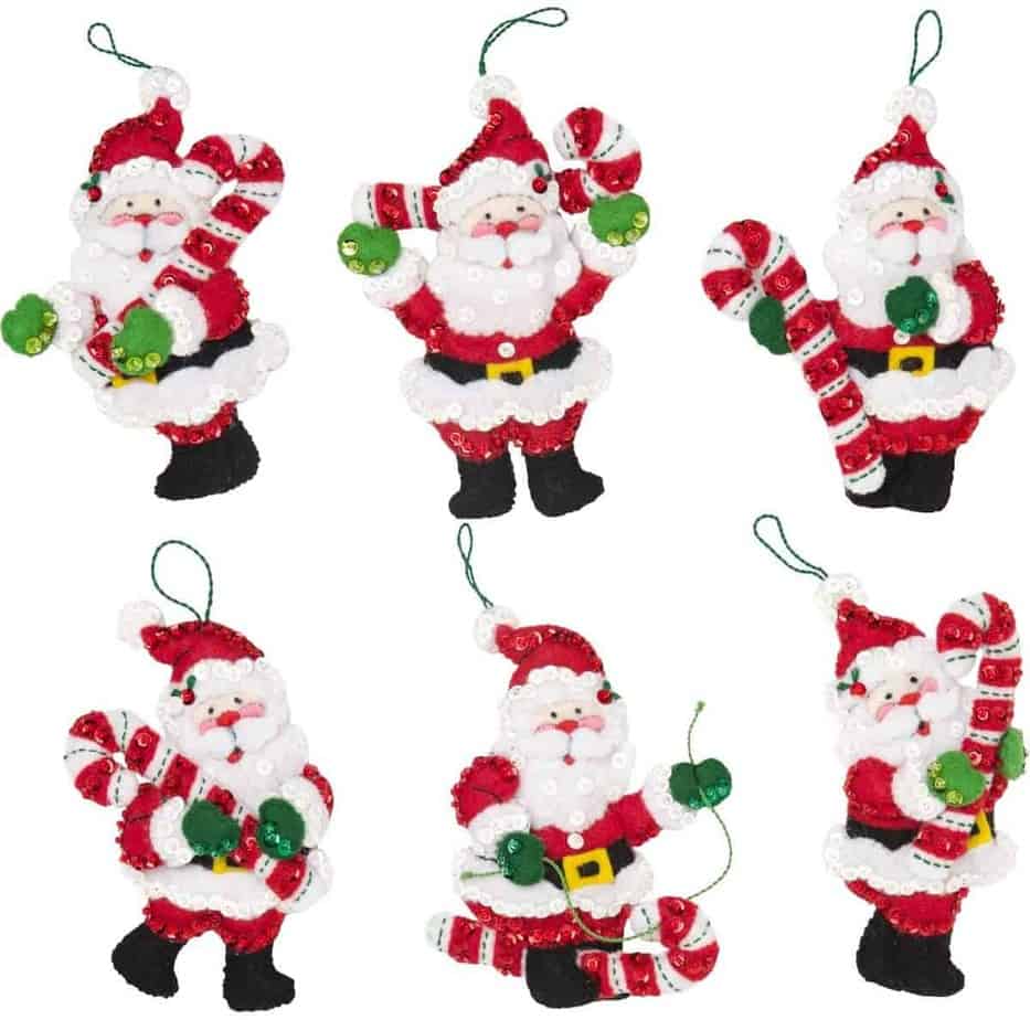 6 felt Santa ornamanets with Santa holding a candy cane in different ways