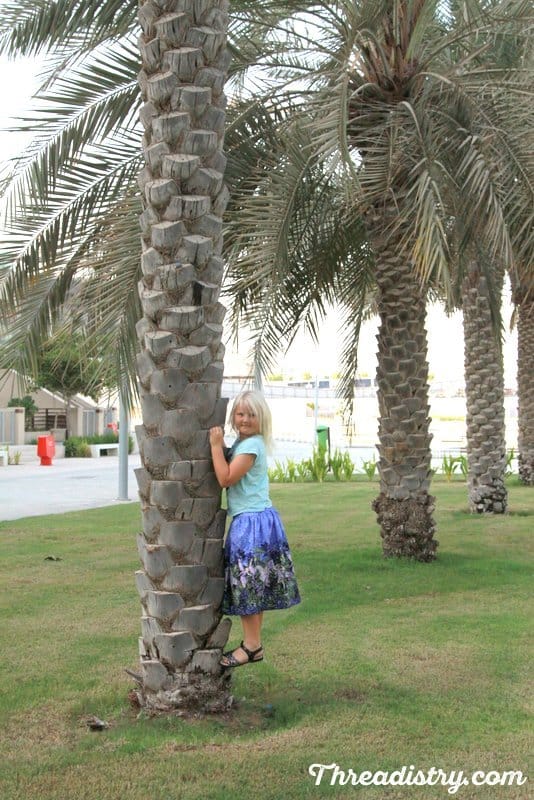 Climbing a tree in the Schatje skirt. Sewing Pattern by the Eli Monster