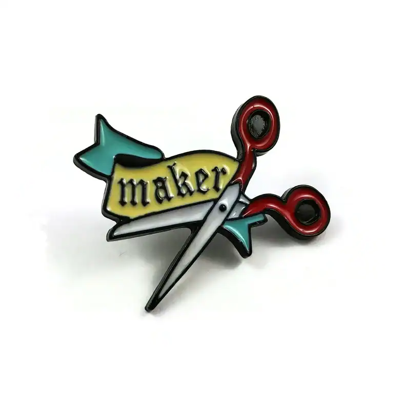 Colorful Maker Scarab pin with scissors and banner, perfect for DIY enthusiasts and craft lovers.