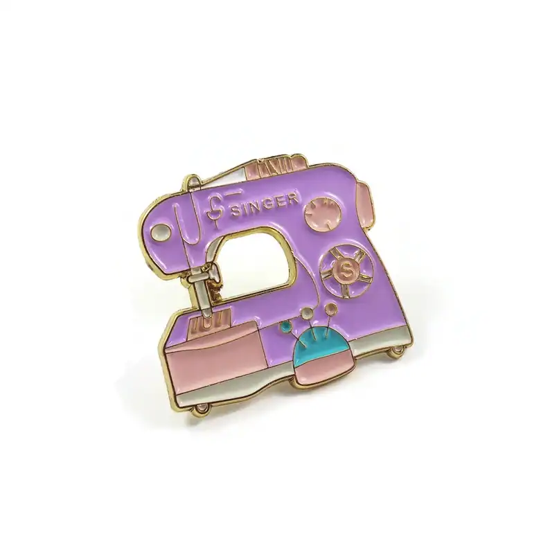 Colorful sewing machine enamel pin, cute craft accessory, unique brooch for sewing and textile lovers, Threadistry jewelry design.