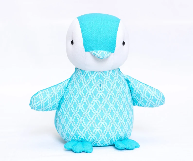 Cute blue and white penguin toy made from baby penguin sewing pattern