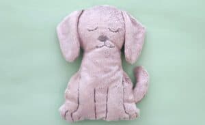 Flat Puppy plush toy on mint green background