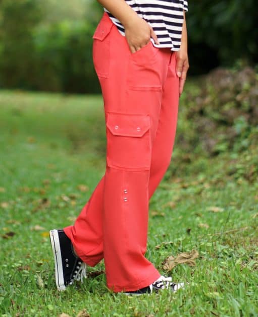 Relaxed fit coral cargo pants for women, versatile and stylish for casual outdoor wear.