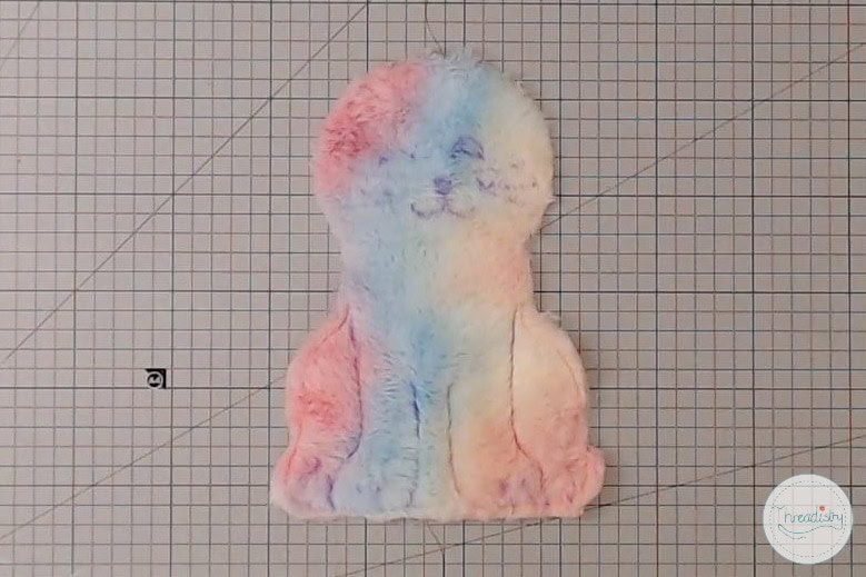 Colorful plush alpaca toy with pastel rainbow hues, perfect for cozy cuddle and home decor.