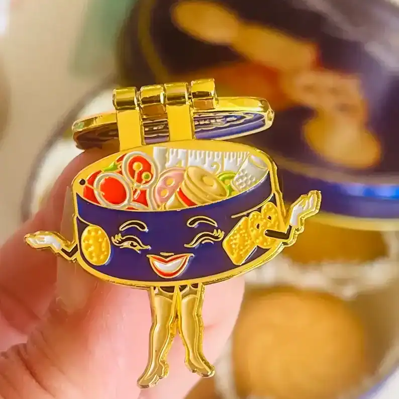 Crispy sushi character enamel pin with happy face and snack accessories.