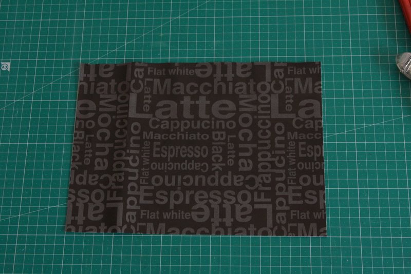 Black coffee-themed text printed fabric for crafting and sewing projects.