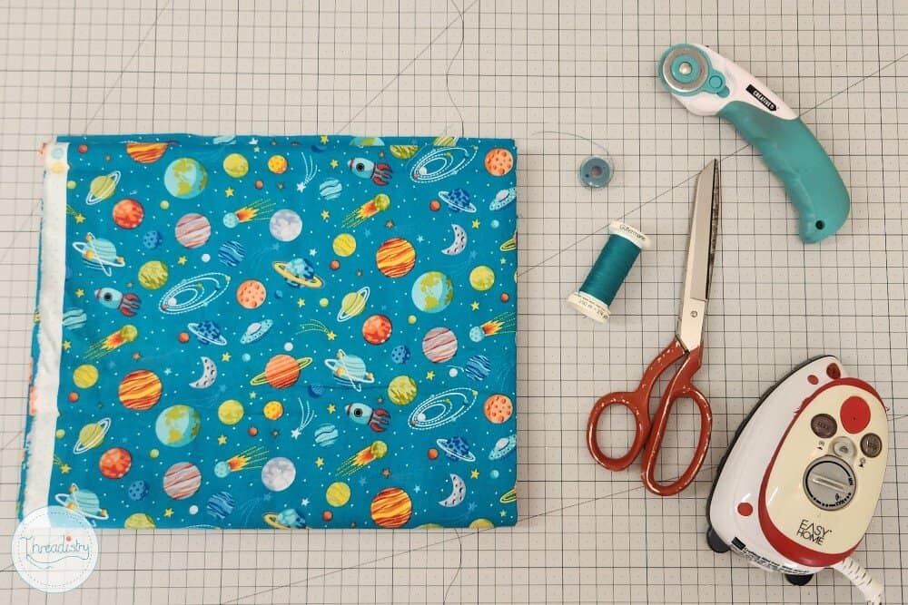 Bright planetary and galaxy print fabric for creative sewing crafts and projects.