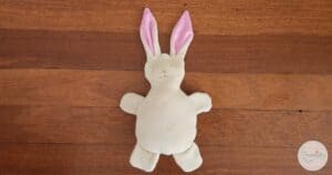 Handmade bunny plush toy with pink ears, perfect for sewing projects and kids' crafts.